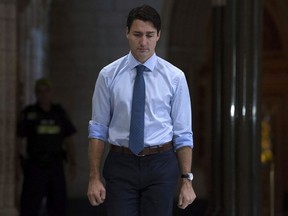 Canadian Prime Minister Justin Trudeau makes his way to caucus on Parliament Hill, in Ottawa on Wednesday, October 18, 2017.