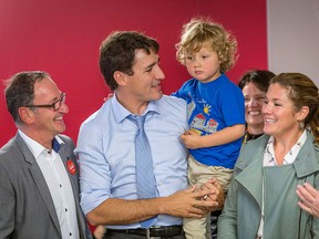 Richard Hebert, Liberal candidate for the byelection in Lac-Saint-Jean, Justin Trudeau, Sophie Gregoire and their son Hadrien, 3, are seen at a seniors' home in Roberval, Que., on Thursday, Oct. 19, 2017. THE CANADIAN PRESS/Francis Vachon