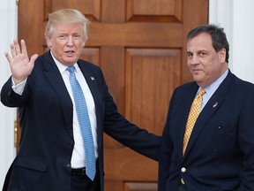 In this Nov. 20, 2016 file photo, then U.S. President-elect Donald Trump, left, waves to the media as New Jersey Gov. Chris Christie arrives at the Trump National Golf Club Bedminster clubhouse, in Bedminster, N.J. (AP Photo/Carolyn Kaster, File)