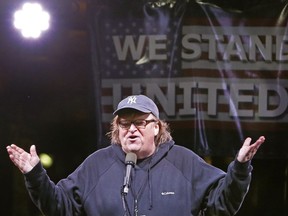 This Jan. 19, 2017, file photo shows filmmaker Michael Moore speaking to thousands of people at an anti-Trump rally and protest in front of the Trump International Hotel in New York.
