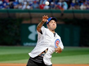 Pete Wentz of the band Fall Out Boy throws out a ceremonial first pitch before the game between the Chicago Cubs and the St. Louis Cardinals at Wrigley Field on September 16, 2017 in Chicago, Illinois. (Photo by Jon Durr/Getty Images)
