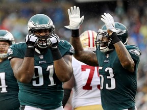 Philadelphia Eagles' Fletcher Cox (left) and Nigel Bradham react after Cox nearly picked off the ball against the San Francisco 49ers (GETTY IMAGES)