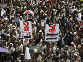 In this  Sept. 12, 2014  photo, Houthi Shiite protest after fellow protesters were killed in  clashes with Yemeni police, during a funeral procession in Sanaa, Yemen. Yemen's 2011 Arab Spring revolt began with a nucleus of young men and women, a mix of socialists, secularists and moderate Islamists seeking to end autocrat Ali Abdullah Saleh's 33-year rule and transform the poorest Arab nation into a democratic, modern society.  That dream never materialized as the country is now plagued by war.