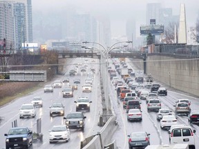Vehicles makes there way into and out of downtown Toronto along the Gardiner Expressway on November 24, 2016.