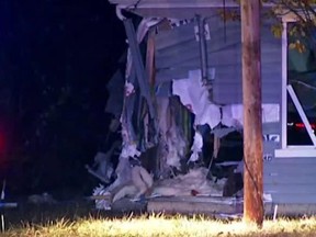 The scene after a car fleeing police crashes into an Ohio home, killing a 39-year-old woman and her 7-year-old son in the living room.