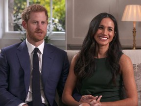 Prince Harry and Meghan Markle talk about their engagement during an interview in London, Monday, Nov. 27, 2017. (Pool via AP)