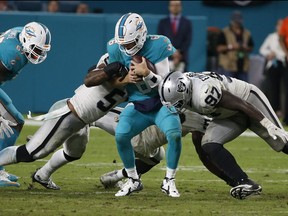 Two Oakland Raiders slam into Miami Dolphins quarterback Jay Cutler. Broadcast legend Bob Costas says the violent nature of the NFL will doom it.