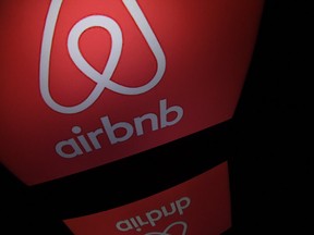 This file photo shows the logo of online lodging service Airbnb displayed on a computer screen in Paris.