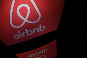 This file photo shows the logo of online lodging service Airbnb displayed on a computer screen in Paris.