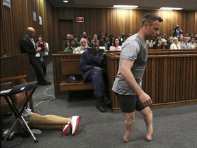 Oscar Pistorius demonstrates his difficult getting around at his 2014 murder trial. Prosecutors say the judge put too much emphasis on the former Olympians disability.