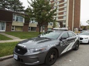 Police cruisers at a TCHC building in North York on Oct 29, following a murder at the complex.