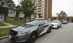 Police cruisers at a TCHC building in North York on Oct 29, following a murder at the complex.