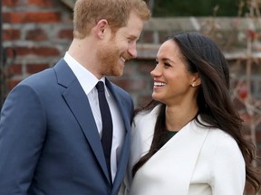 Prince Harry and actress Meghan Markle during an official photocall to announce their engagement at The Sunken Gardens at Kensington Palace.