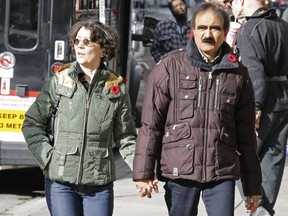 Anne Cottavoz and her husband, Paul Singh, wear poppies on Yonge St. on Monday, Nov. 6, 2017.