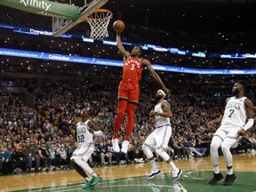 Toronto Raptors forward OG Anunoby goes in for a dunk against the Boston Celtics on Sunday. (AP PHOTO)