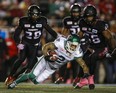 Long-time Argonaut Chad Owens, now a Roughrider, dives for extra yards against the Stampeders during a game in Calgary last month. (THE CANADIAN PRESS)