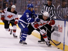 Connor Carrick and Taylor Hall battle during Maple Leafs-Devils on Nov. 16, 2017