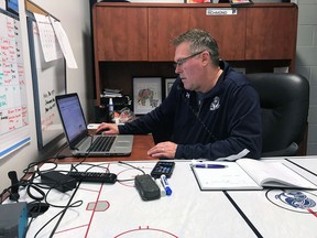 Mississauga Steelheads GM/coach James Richmond works away inside his office at the Hershey Centre