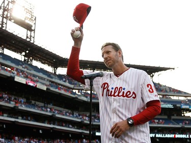 Roy Halladay salutes Phillies fans before a game in 2014 (AP)