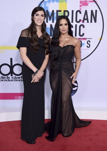 Demi Lovato, right, and Virginia state Representative-elect Danica Roem arrive at the American Music Awards at the Microsoft Theater on Sunday, Nov. 19, 2017, in Los Angeles. Roem will be Virginia's first transgender lawmaker. (Photo by Jordan Strauss/Invision/AP)