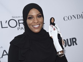 Ibtihaj Muhammad holds a Barbie doll in her likeness at the 2017 Glamour Women of the Year Awards at Kings Theatre on Monday, Nov. 13, 2017, in New York.