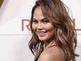 Honoree Chrissy Teigen poses at the 2017 Revolve Awards at the Dream Hollywood hotel on Thursday, Nov. 2, 2017, in Los Angeles. (Photo by Chris Pizzello/Invision/AP)