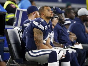 Dallas Cowboys quarterback Dak Prescott sits on the bench late in Thursday's game against the Los Angeles Chargers. (AP PHOTO)