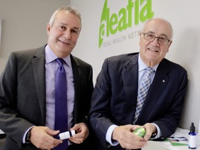 Julian Fantino (R) and  Raf Souccar