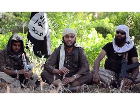 A file image grab uploaded on June 19, 2014, by Al-Hayat Media Centre shows 21-year-old British citizen Reyaad Khan, (L) 20-year-old British citizen Abu Muthanna al-Yemeni (C), believed to be Nasser Muthana, and-26 year-old British citizen Ruhul Amin (R) in an online video entitled "There is no life without Jihad" from an undisclosed location. (AL HAYAT MEDIA CENTRE, AFP/Getty Images)