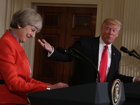 President Donald Trump (R) and British Prime Minister Theresa May (L) participate in a joint press conference in the East Room of the White House January 27, 2017 in Washington, DC.