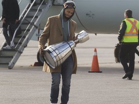 Toronto Argonauts' DeVier Posey with the Grey Cup on Nov. 27, 2017
