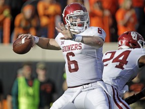 A Heisman finalist three years running, we’re saying Oklahoma QB Baker Mayfield will finally win it with another signature effort this weekend. (Photo by Brett Deering/Getty Images)