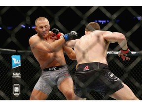 Michael Bisping of England throws a punch against Georges St-Pierre of Canada in their UFC middleweight championship bout during the UFC 217 event at Madison Square Garden on November 4, 2017 in New York City. (Photo by Mike Stobe/Getty Images)