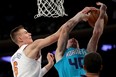 Kristaps Porzingis of the New York Knicks blocks Cody Zeller of the Charlotte Hornets on Nov. 7, 2017