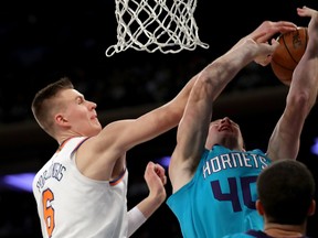 Kristaps Porzingis of the New York Knicks blocks Cody Zeller of the Charlotte Hornets on Nov. 7, 2017