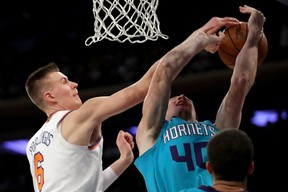 Kristaps Porzingis of the New York Knicks blocks Cody Zeller of the Charlotte Hornets on Nov. 7, 2017