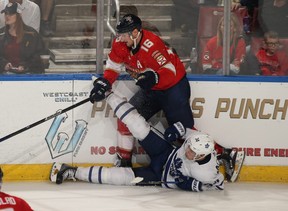 Auston Matthews #34 of the Toronto Maple Leafs goes to the ice after being checked by Aleksander Barkov #16 of the Florida Panthers at the BB and T Center on November 22, 2017 in Sunrise, Florida. (Photo by Joel Auerbach/Getty Images)