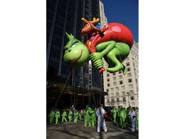 The Dr. Seuss Grinch and Max balloon floats down Central Park West and into Columbus Circle during the 91st Annual Macy's Thanksgiving Day Parade on 
Nov. 23, 2017 in New York City.  (Michael Loccisano/Getty Images)