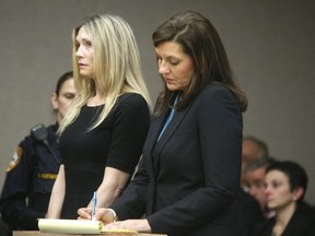 Amy Locane Bovenizer , left, and her Defense Attorney Ellen Torregrossa-O'Connor listen as she is sentenced on Thursday, Feb. 14, 2013 in Somerville, N.J.  (AP Photo/The Star-Ledger, Patti Sapone, Pool, File)