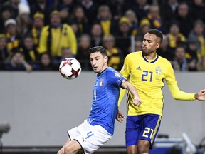 Italy's midfielder Matteo Darmian and Sweden's forward Isaac Kiese Thelin vie for the ball during the FIFA World Cup 2018 qualification football match between Sweden and Italy in Solna, on November 10, 2017.
