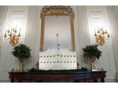 The White House Gingerbread House is seen in the State Dining Room during a preview of Christmas and holiday decorations at the White House in Washington, DC, November 27, 2017. SAUL LOEB/AFP/Getty Images