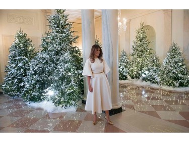 US First Lady Melania Trump walks through the Grand Foyer as she tours Christmas decorations at the White House in Washington, DC, November 27, 2017. SAUL LOEB/AFP/Getty Images
