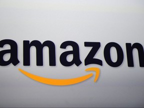 The Amazon logo projected on a screen at a press conference in New York.