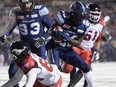 Toronto Argonauts defensive back Cassius Vaughn recovers the football on a fumble by Calgary Stampeders slotback Kamar Jorden on Nov. 26, 2017