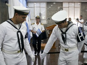 Navy spokesman Enrique Balbi walks away from the podium after taking part in a press conference at Navy headquarters in Buenos Aires, Argentina, Wednesday, Nov. 29, 2017.
