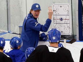 Mike Babcock talks to Maple Leafs players during practice at the MasterCard Centre on Nov. 7, 2017. (Michael Peake/Postmedia)