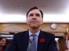 The Senate Committee on National Finance hears from Finance Minister Bill Morneau during a meeting on Parliament Hill in Ottawa on November 1, 2017. Federal ethics watchdog Mary Dawson is launching an examination of Finance Minister Bill Morneau's involvement in a pension bill that could have benefited a company in which he owned some $21 million worth of shares. In a letter to NDP ethics critic Nathan Cullen, Dawson says she believes she has "reasonable grounds" to commence an examination of Morneau's conduct, under sect. 45(1) of the Conflict of Interest Act. THE CANADIAN PRESS/Sean Kilpatrick