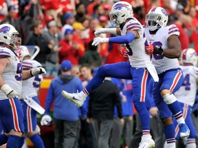 Buffalo Bills players, from left to right, Kyle Williams, Micah Hyde and Ryan Davis celebrate an interception against the Kansas City Chiefs on Nov. 26, 2017