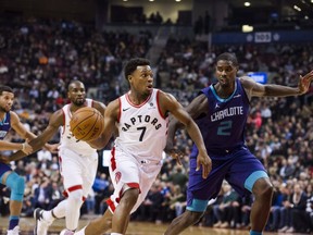 Toronto Raptors guard Kyle Lowry (7) drives past Charlotte Hornets forward Marvin Williams during the first half of NBA basketball action in Toronto on Wednesday, November 29, 2017. THE CANADIAN PRESS/Christopher Katsarov