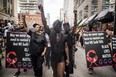 People from the Blacks Lives Matter movement march during the Pride parade in Toronto, Sunday, June 25, 2017.